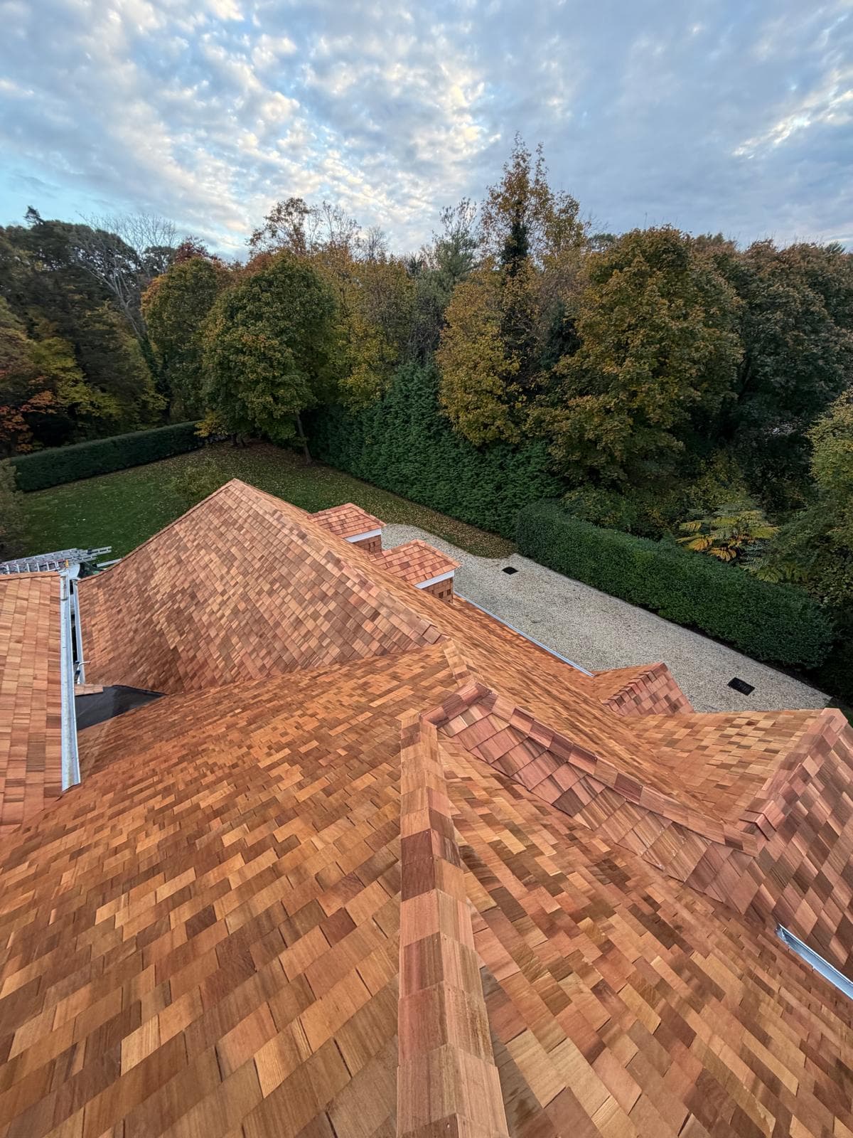 Close-up of a cedar shake roof along the ridge