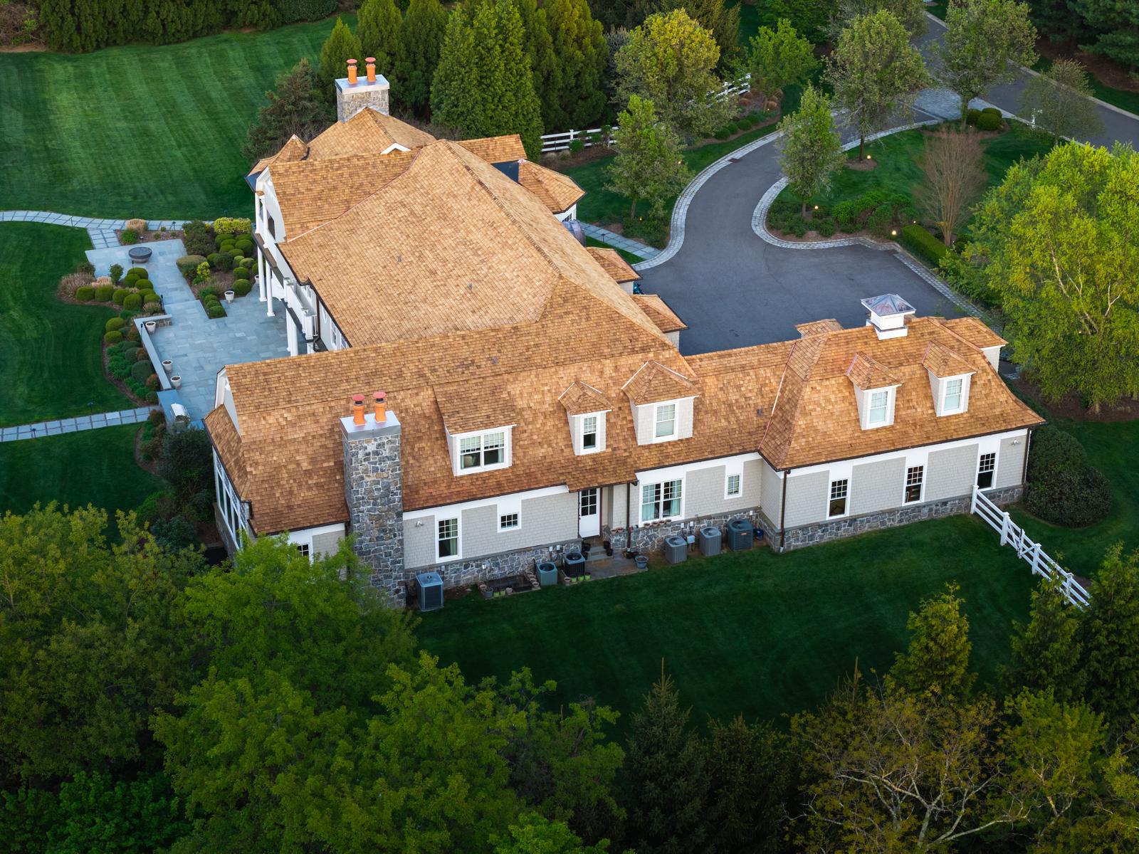 Stone chimney on a cedar shake roof, seen from above